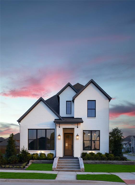 651 Caprice Bluff Fate, TX 75189 - Photo 2 of 26 a front view of a house with a yard