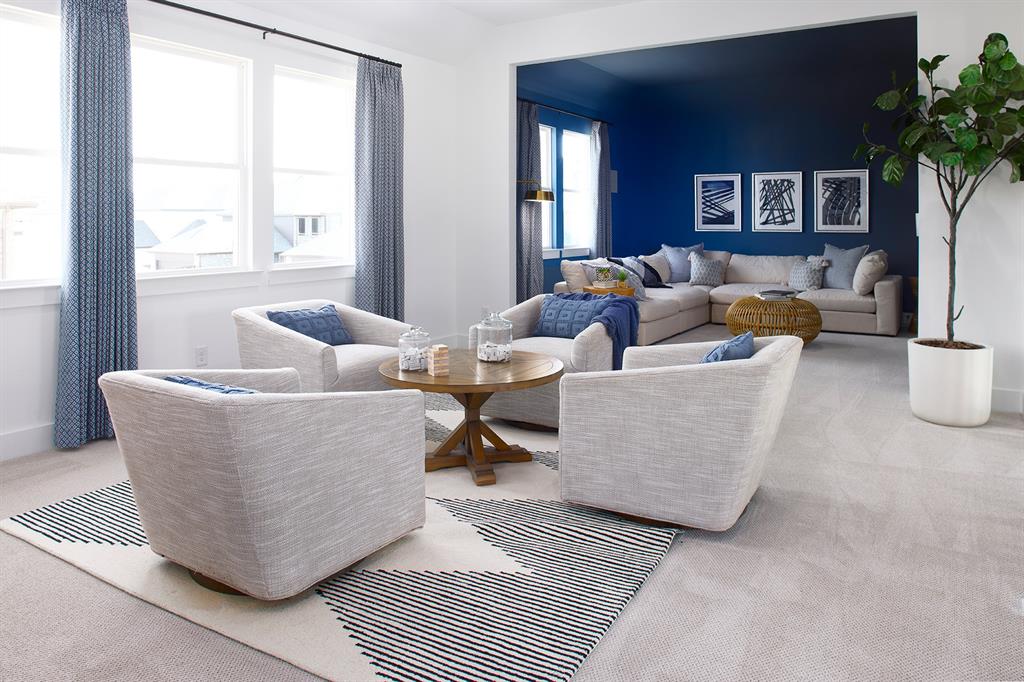 651 Caprice Bluff Fate, TX 75189 - Photo 21 of 26 a living room with furniture and a large window