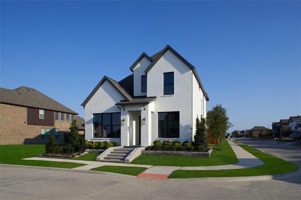 651 Caprice Bluff Fate, TX 75189 - Photo 3 of 26 a front view of a house with a yard