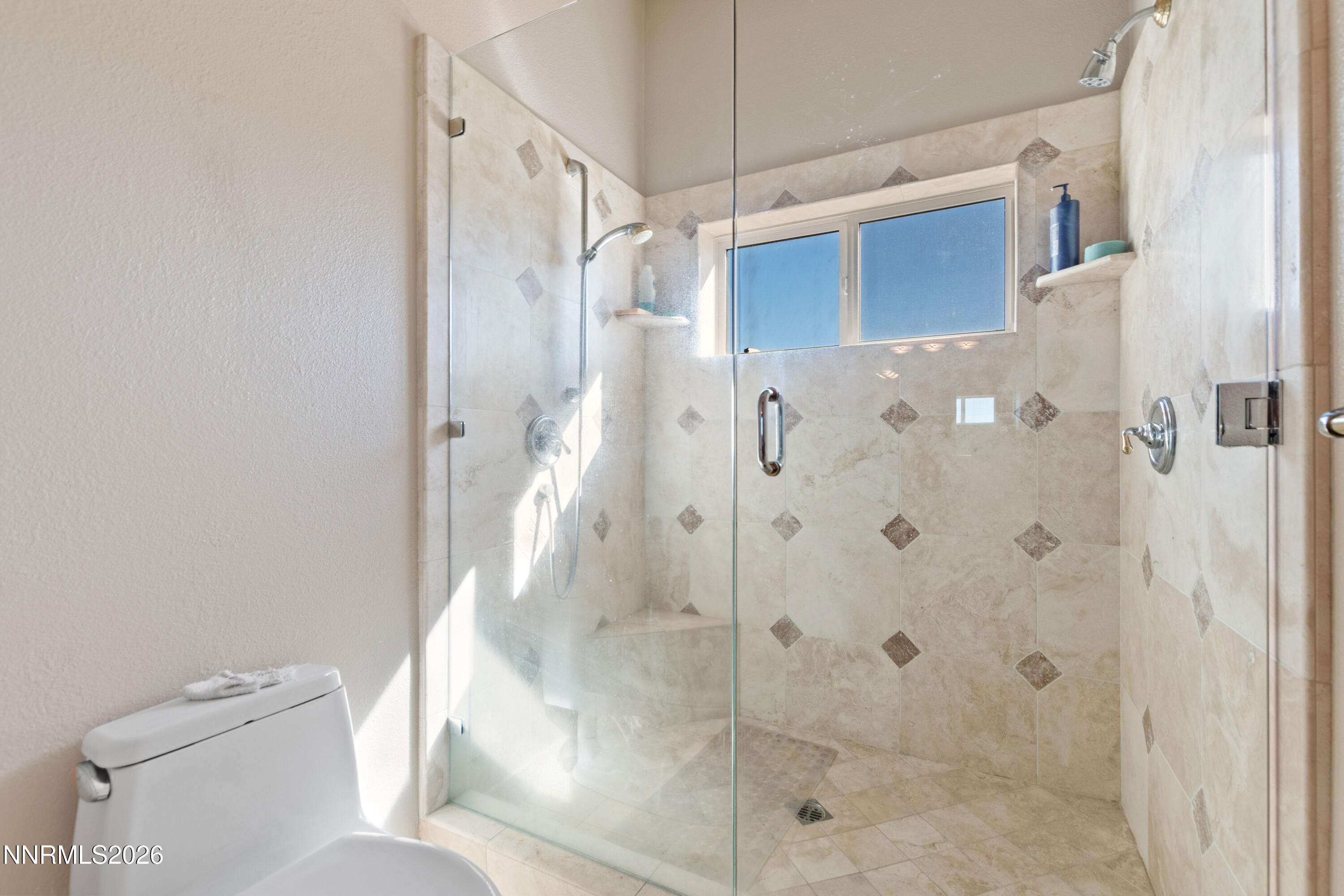 480 Duck Hill Road Washoe Valley, NV 89704 - Photo 13 of 27 a bathroom with a shower and a toilet