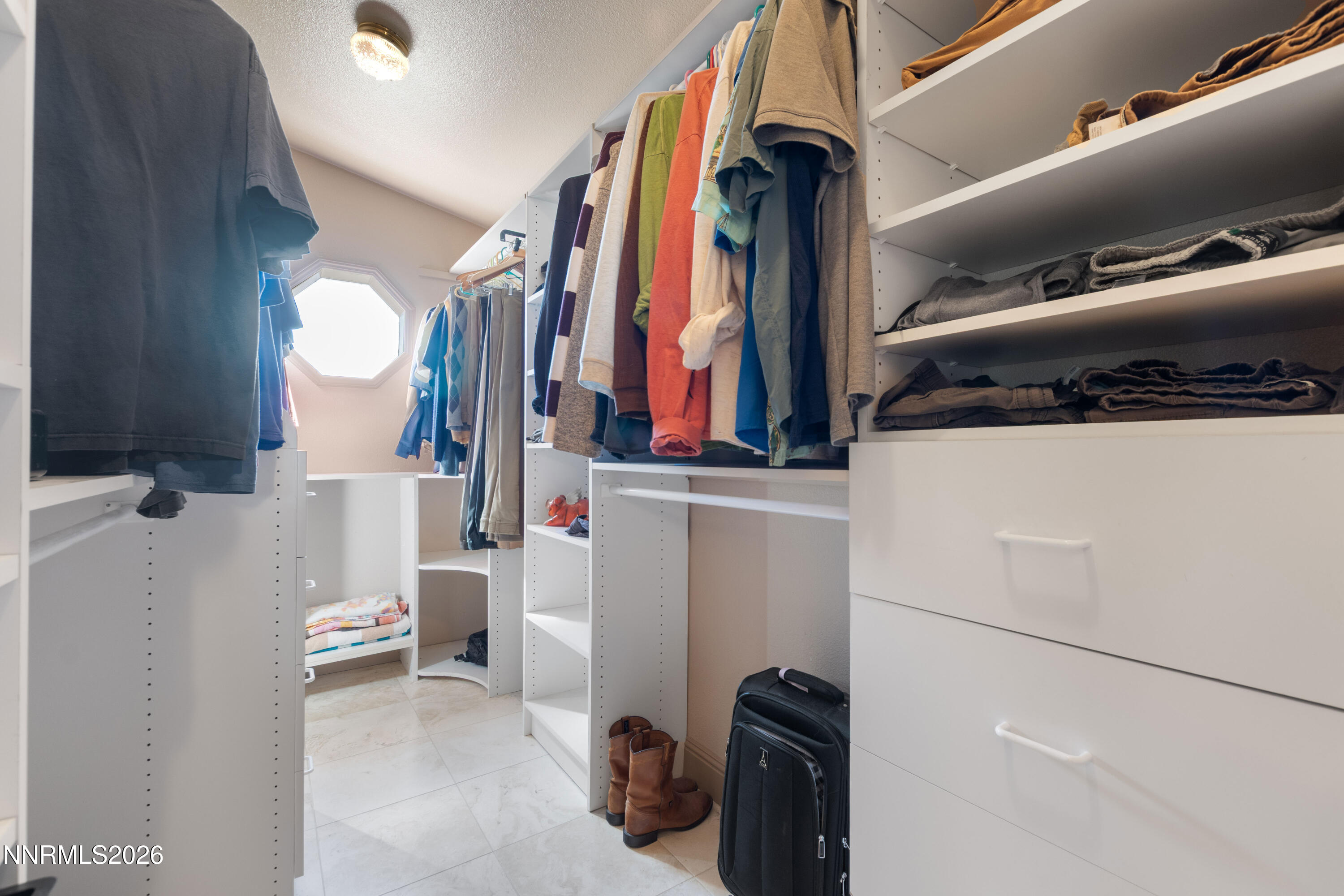 480 Duck Hill Road Washoe Valley, NV 89704 - Photo 14 of 27 a view of walk in closet with clothes and shoes