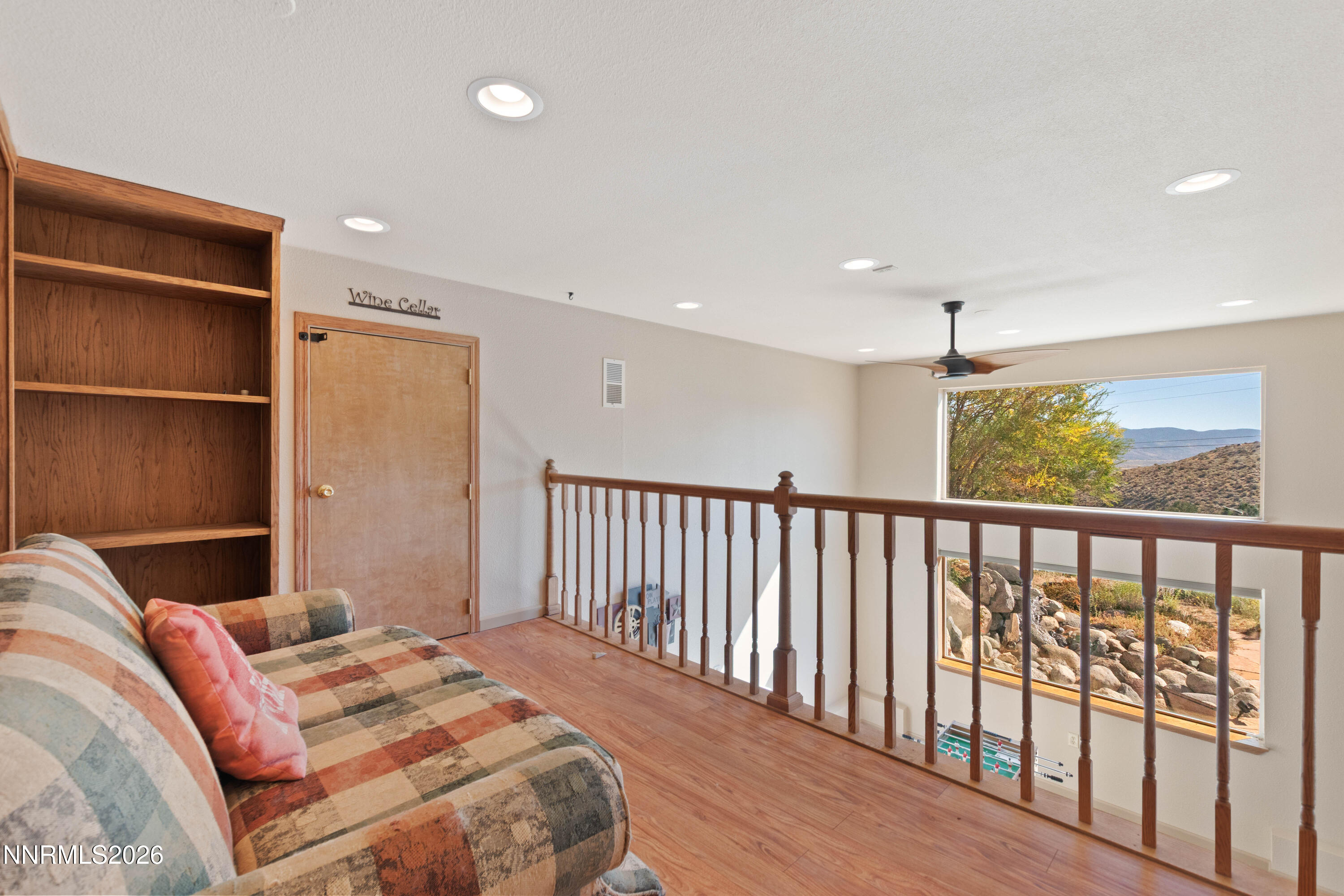 480 Duck Hill Road Washoe Valley, NV 89704 - Photo 15 of 27 a bedroom with a bed and wooden floor