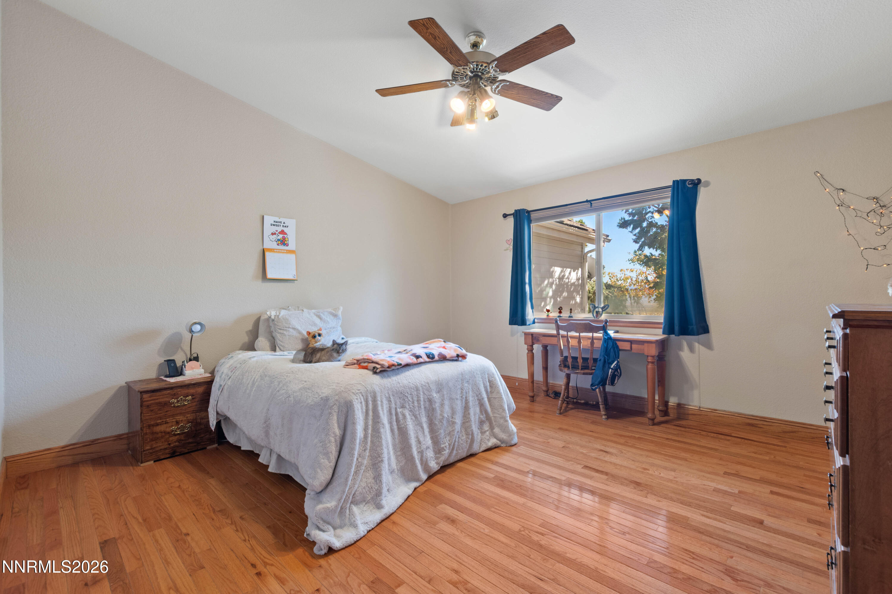 480 Duck Hill Road Washoe Valley, NV 89704 - Photo 18 of 27 a bedroom with two beds and a table