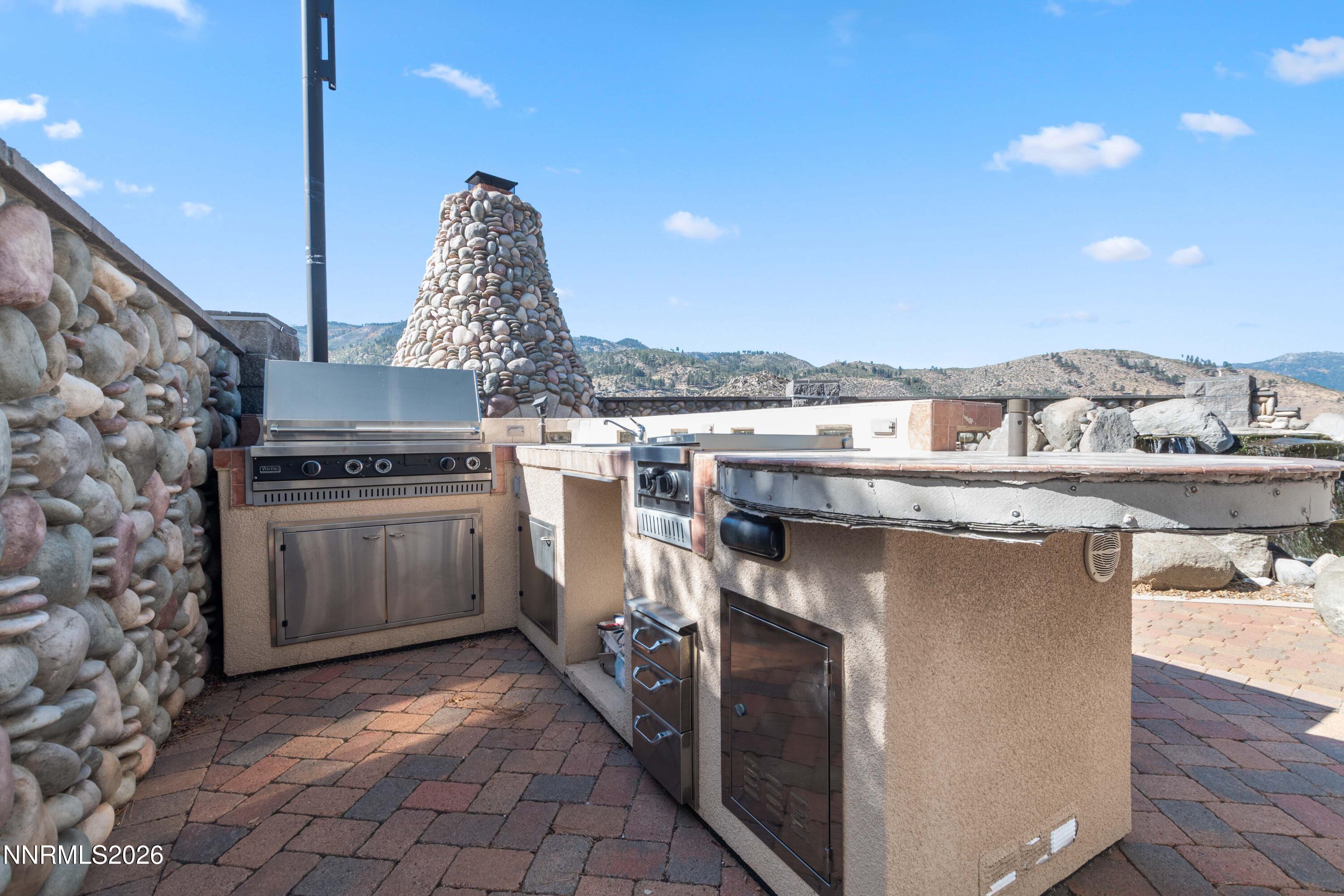 480 Duck Hill Road Washoe Valley, NV 89704 - Photo 21 of 27 a kitchen with a stove and a microwave