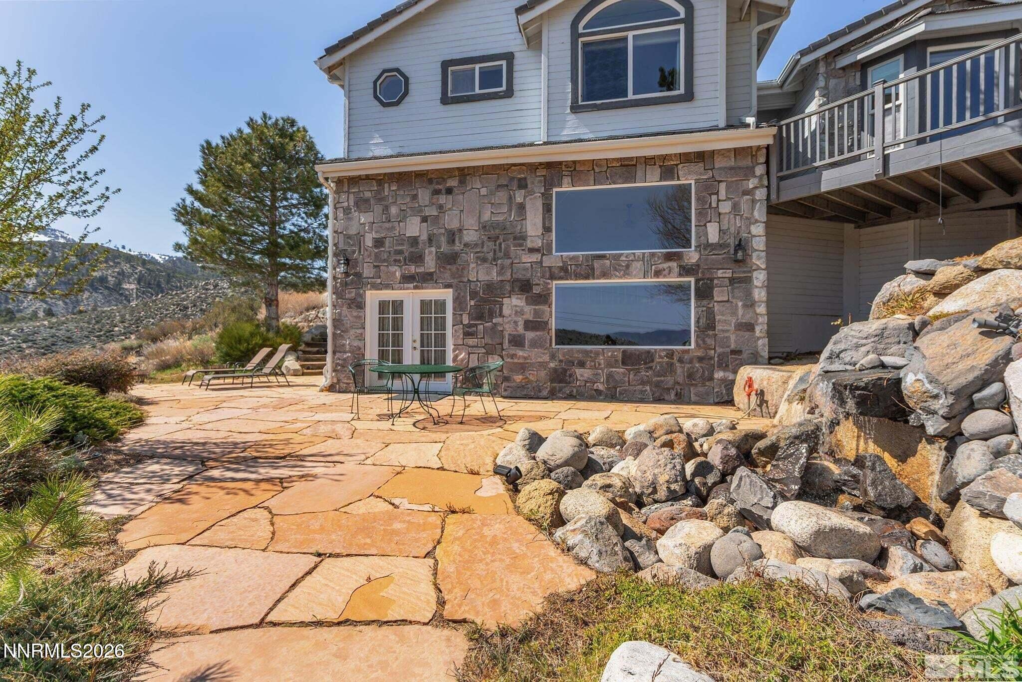 480 Duck Hill Road Washoe Valley, NV 89704 - Photo 24 of 27 a front view of a house with a yard