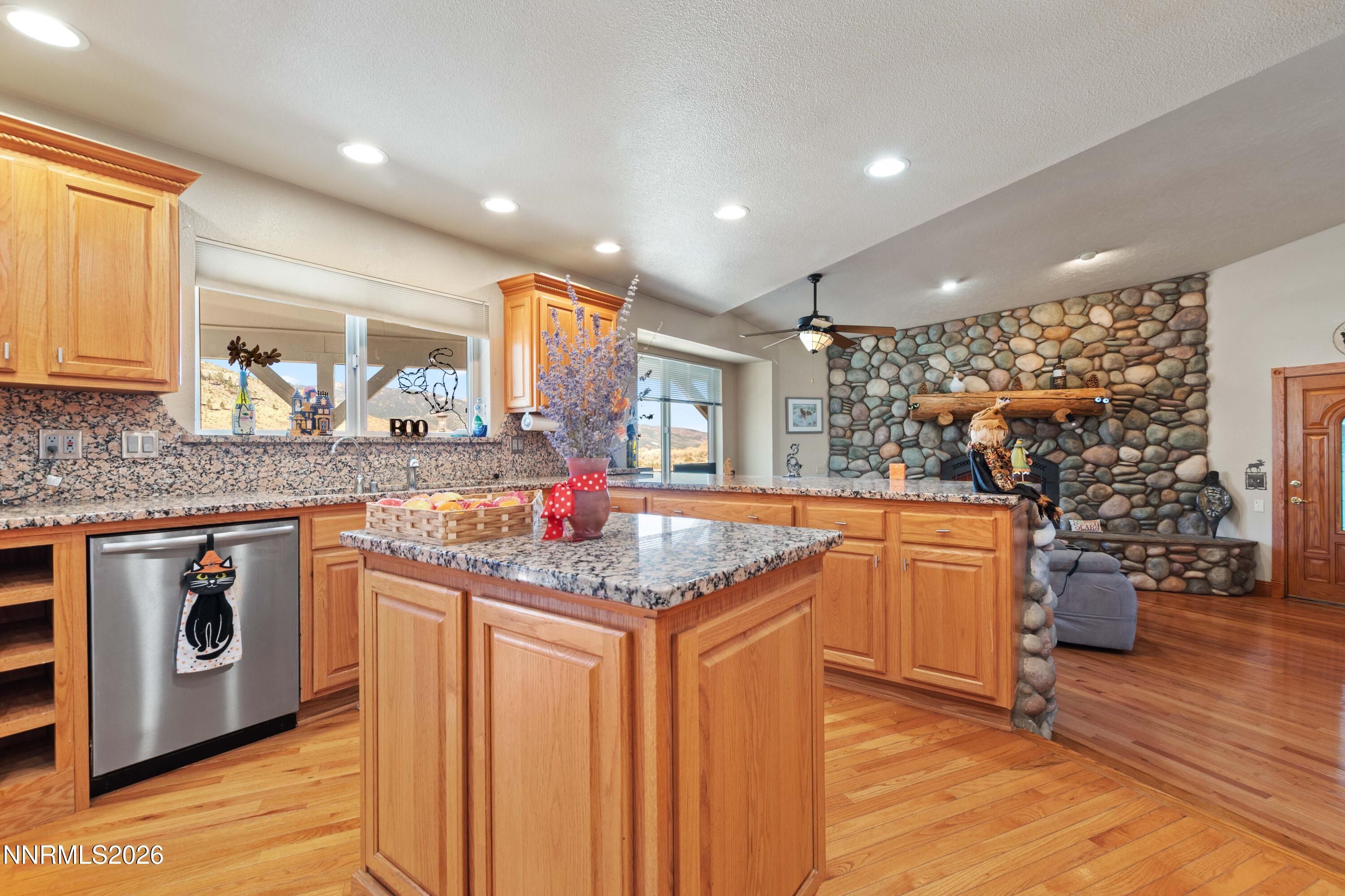 480 Duck Hill Road Washoe Valley, NV 89704 - Photo 6 of 27 a kitchen with stainless steel appliances granite countertop a stove and a sink