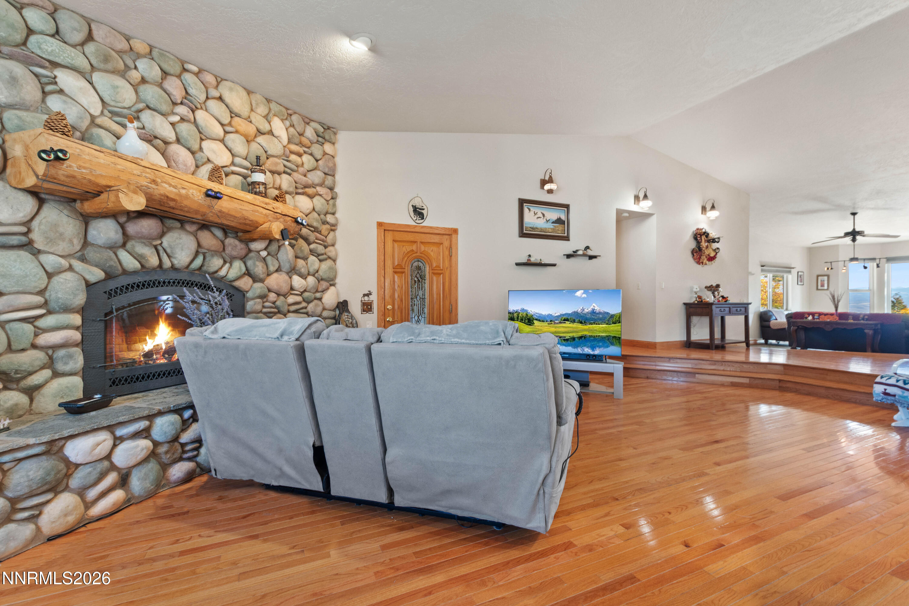 480 Duck Hill Road Washoe Valley, NV 89704 - Photo 9 of 27 a living room with furniture and a fireplace