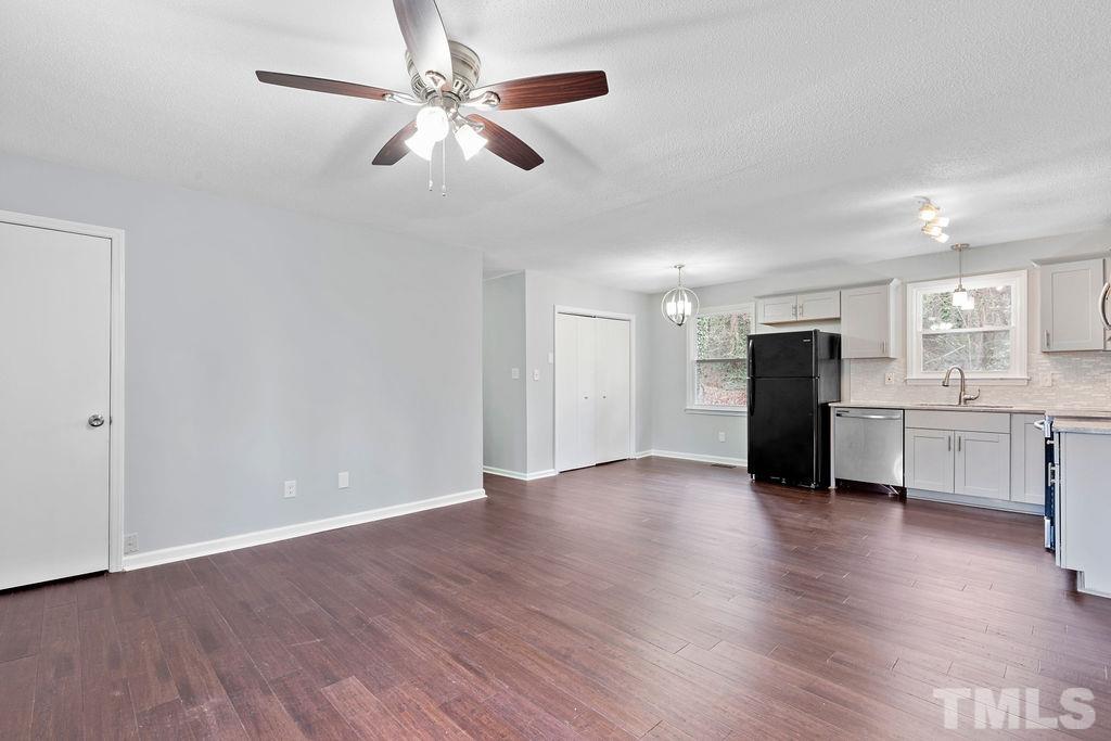 515 Dacian Road Raleigh, NC 27610 - Photo 8 of 21 a view of an empty room with a kitchen
