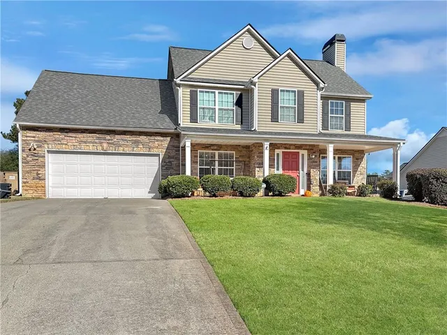 front view of a house with a yard