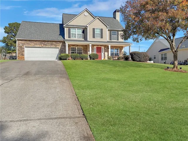 front view of a house with a yard