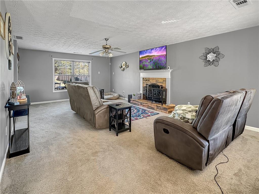 637 Sleeping Meadow Lane Bethlehem, GA 30620 - Photo 3 of 12 a living room with furniture fireplace and window