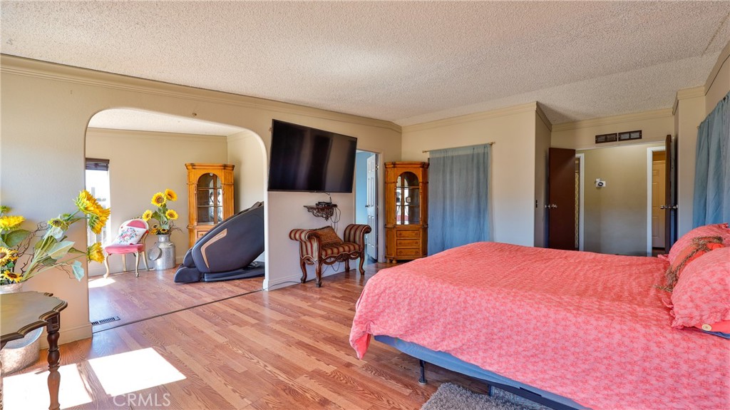 39550 Kirby Road Anza, CA 92539 - Photo 18 of 51 a bedroom with a bed and a flat tv screen on dresser