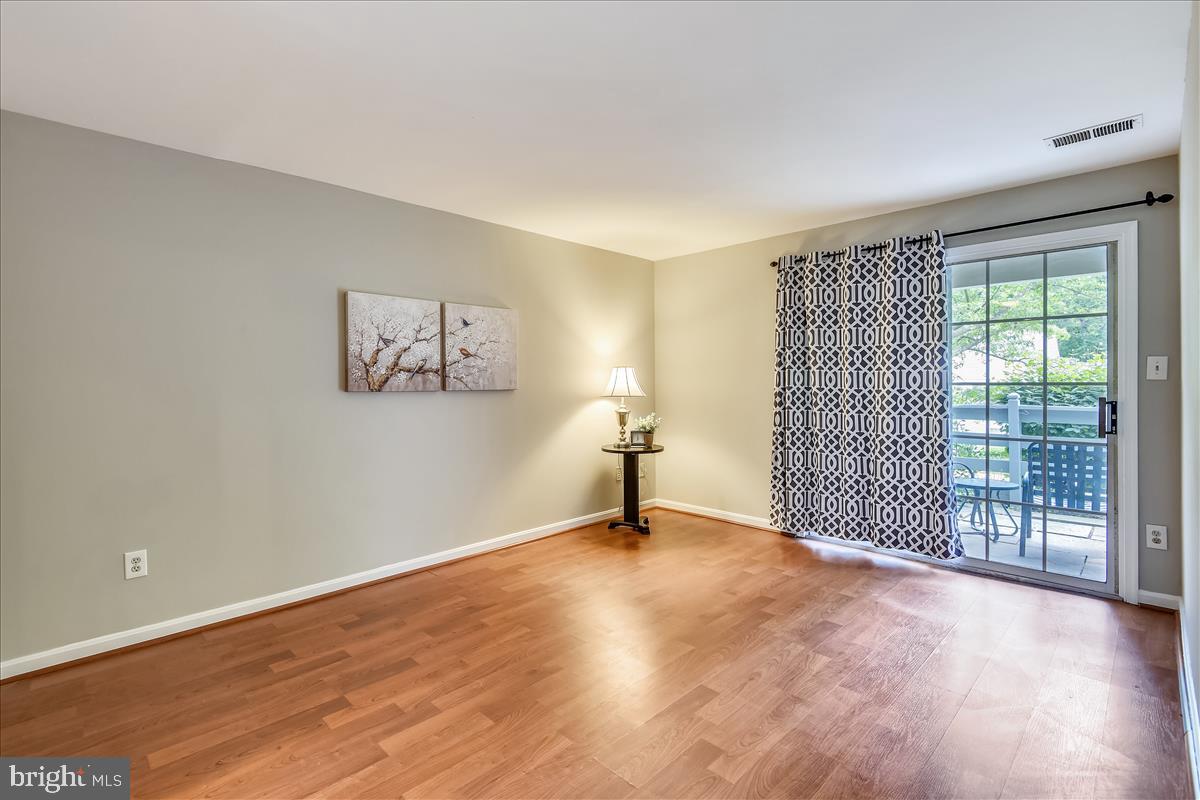 2220 Springwood Drive, Unit 102B Reston, VA 20191 - Photo 15 of 24 Master Bedroom with patio walkout