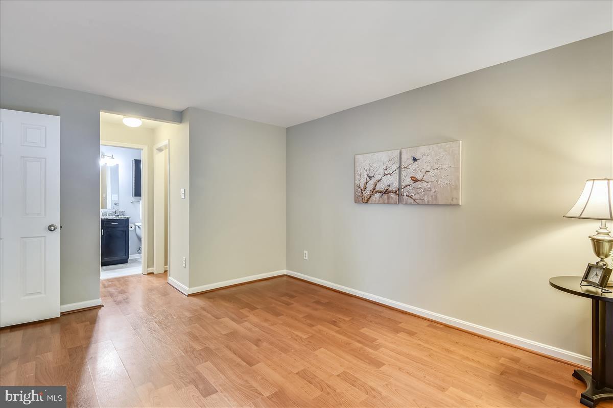 2220 Springwood Drive, Unit 102B Reston, VA 20191 - Photo 16 of 24 Master Bedroom with attached bath