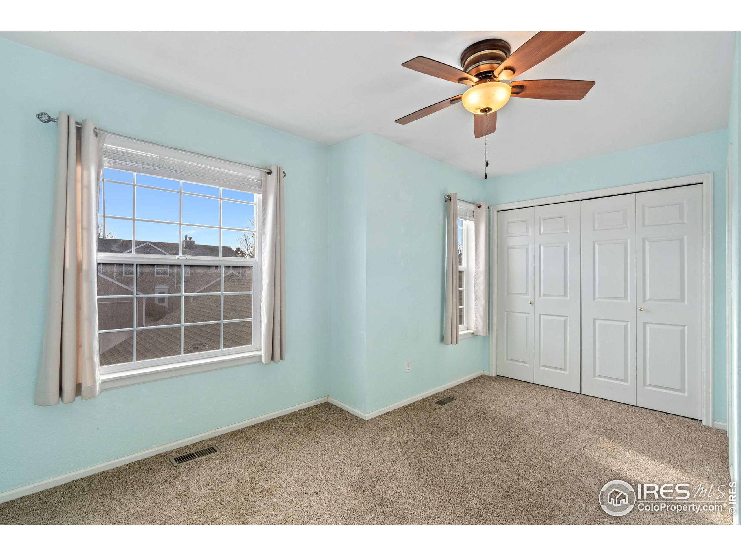 6612 Avondale Road, Unit 2B Fort Collins, CO 80525 - Photo 12 of 20 a view of an empty room with a window