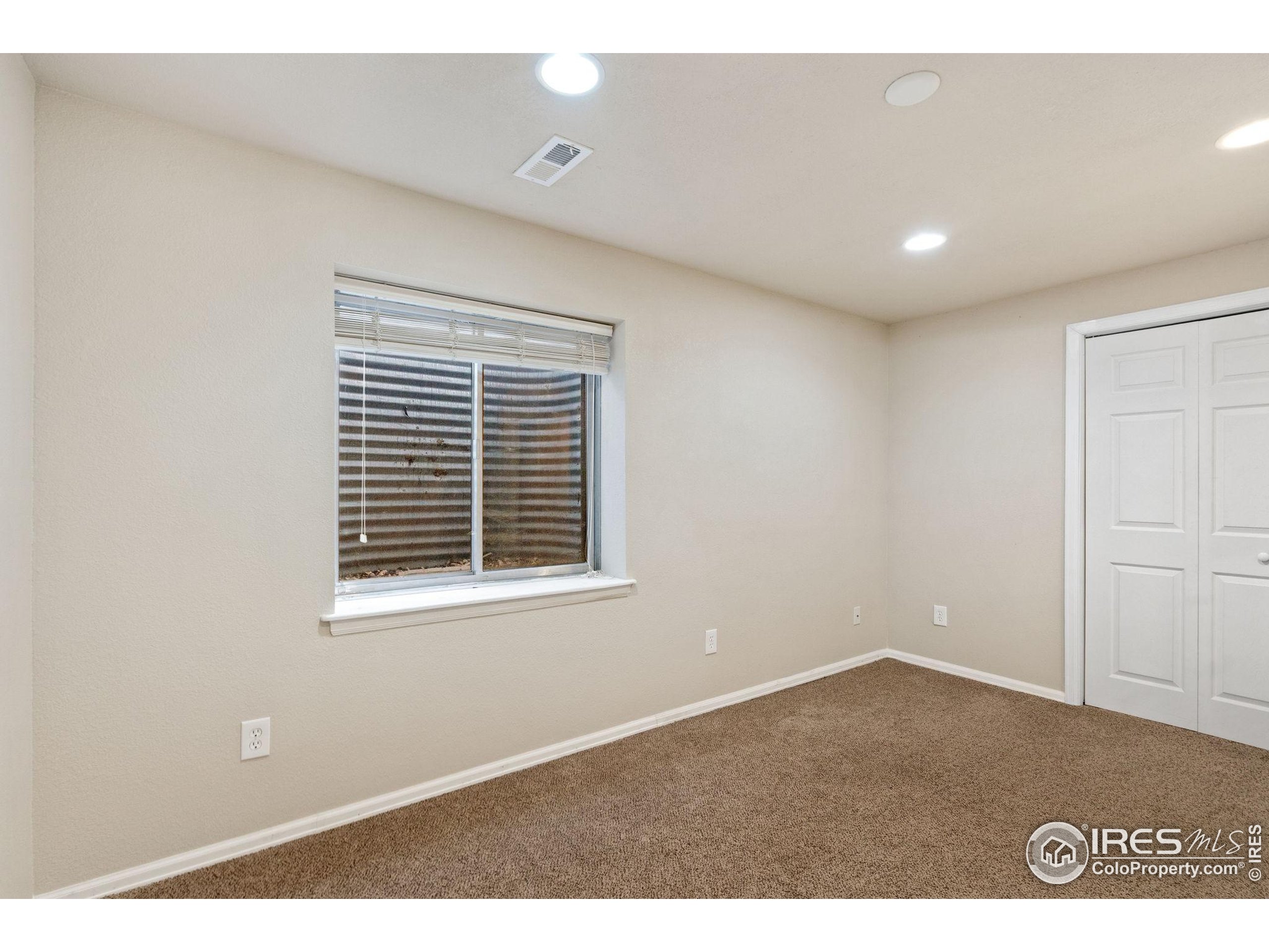 6612 Avondale Road, Unit 2B Fort Collins, CO 80525 - Photo 18 of 20 a view of an empty room with a window