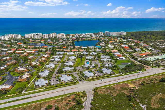 an aerial view of residential building and ocean