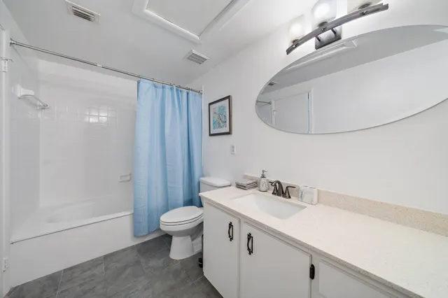 a bedroom with a large bed and a tv