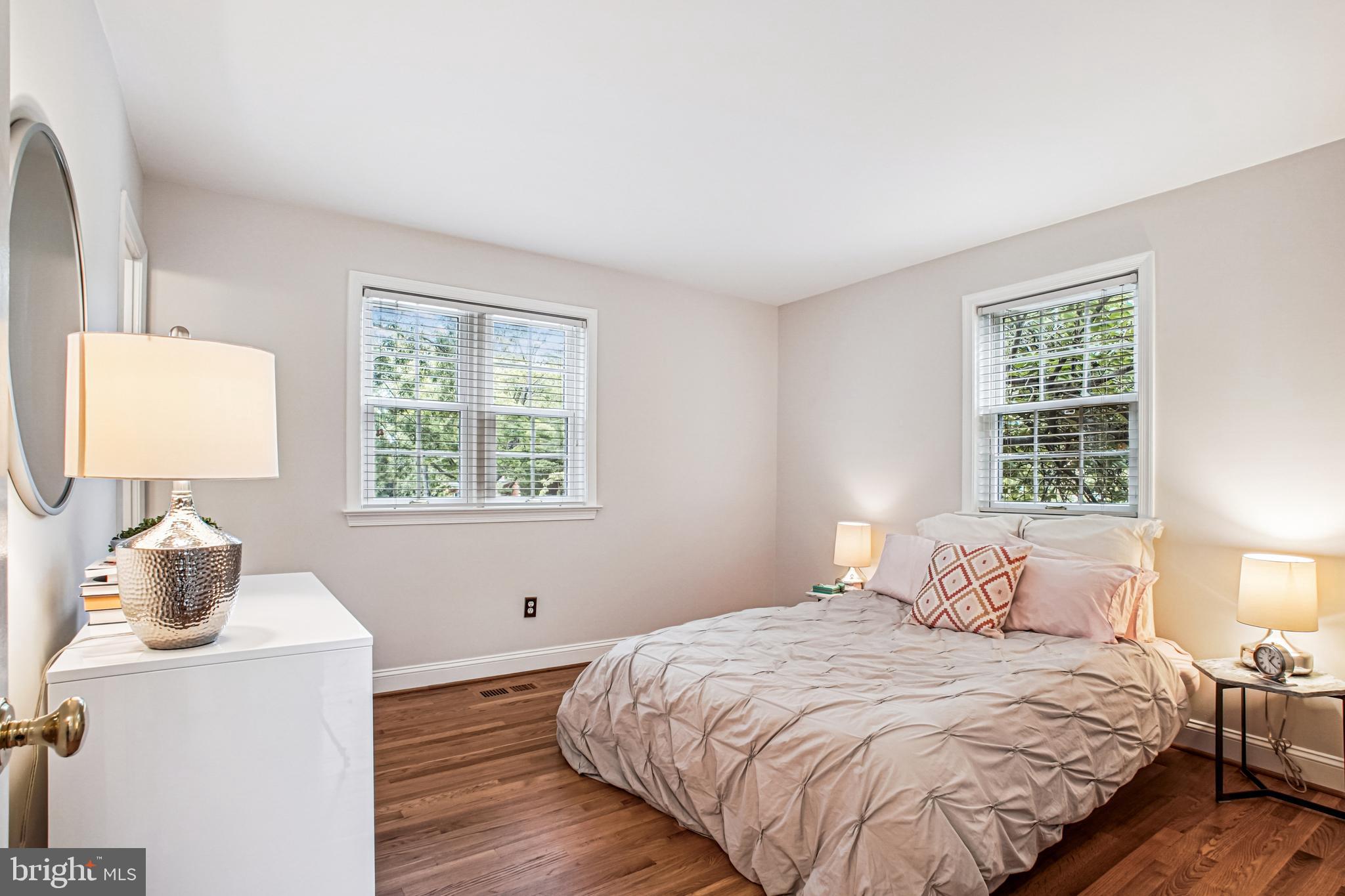 6719 Fairfax Road, Unit 67 Chevy Chase, MD 20815 - Photo 19 of 24 a bedroom with a bed and a window