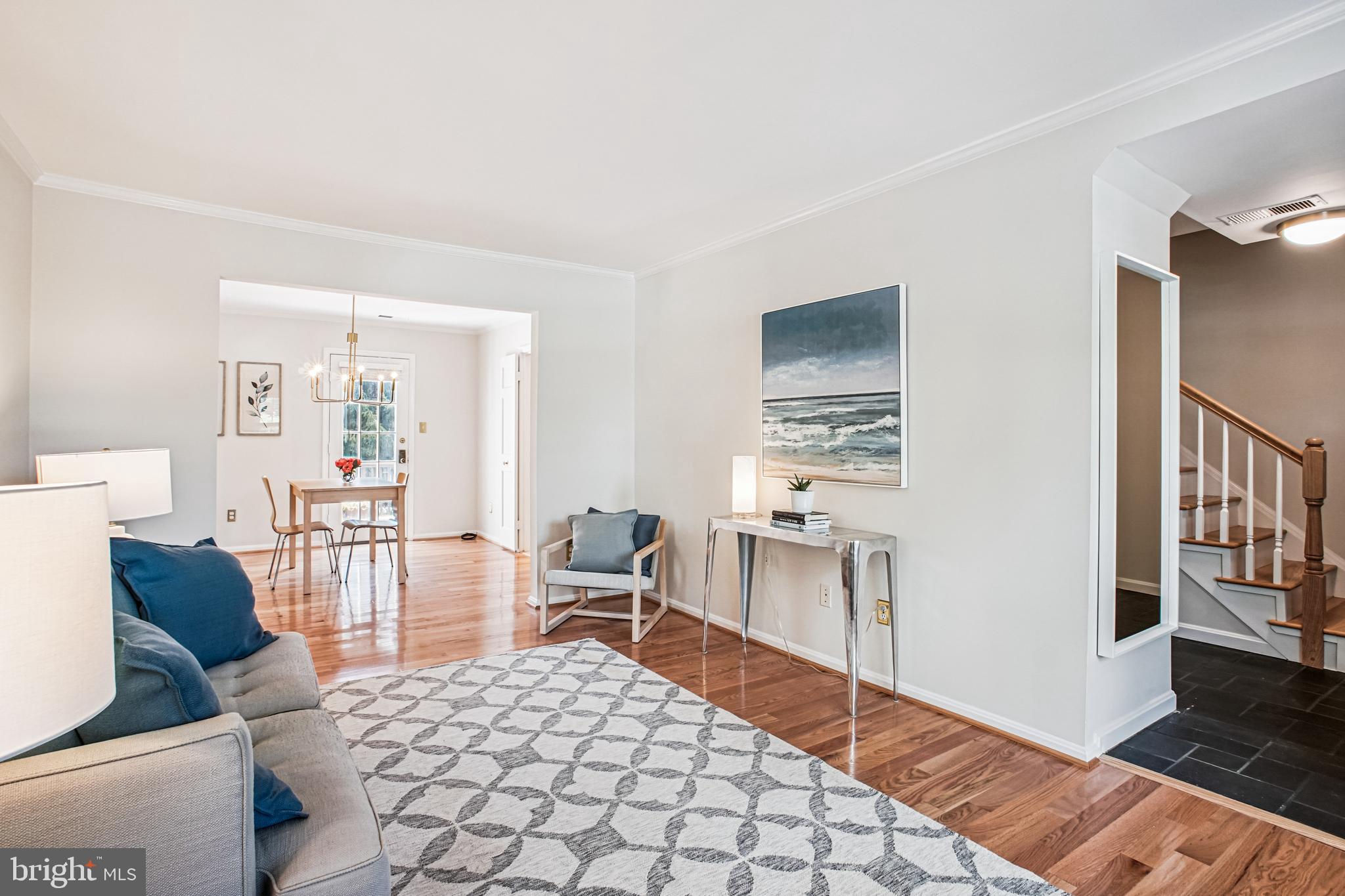 6719 Fairfax Road, Unit 67 Chevy Chase, MD 20815 - Photo 5 of 24 a living room with furniture and a table