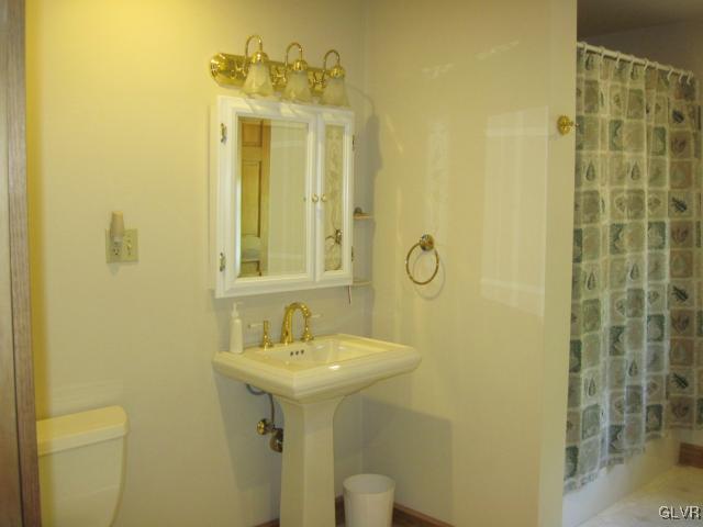 953 Clearfield Road Nazareth, PA 18064 - Photo 17 of 25 a bathroom with a sink a mirror and shower