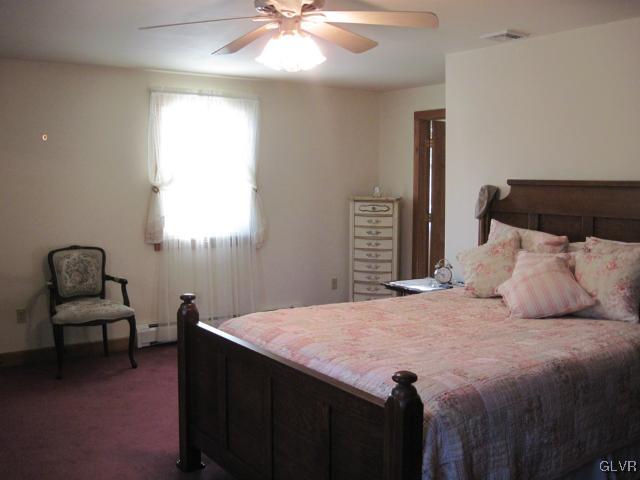 953 Clearfield Road Nazareth, PA 18064 - Photo 19 of 25 a bedroom with a bed and a chair