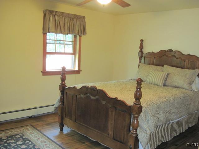 953 Clearfield Road Nazareth, PA 18064 - Photo 20 of 25 a bed sitting in a bedroom next to a window