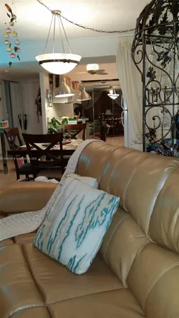 a living room with fireplace furniture and a flat screen tv