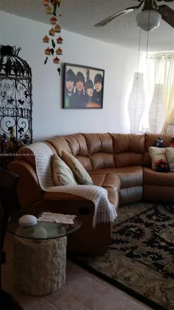 a view of a living room with furniture