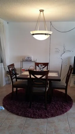 a view of a workspace with furniture