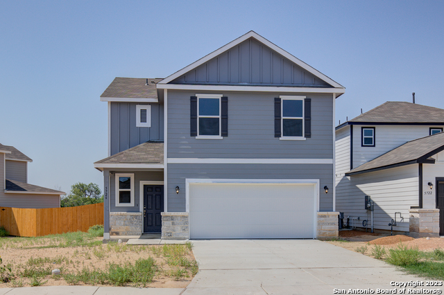 5726 Hematite Rim San Antonio, TX 78222 - Photo 1 of 1 a front view of a house with garden