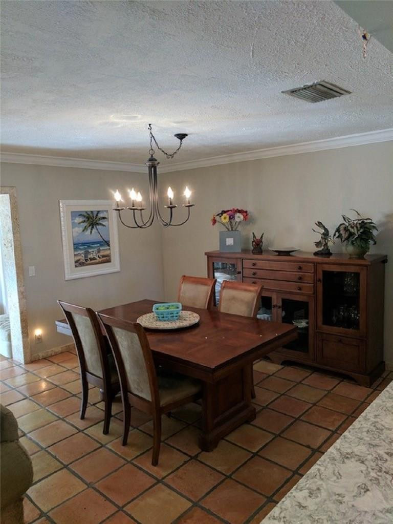 1400 Southwest 9th Street Boca Raton, FL 33486 - Photo 4 of 8 a view of a dining room with furniture