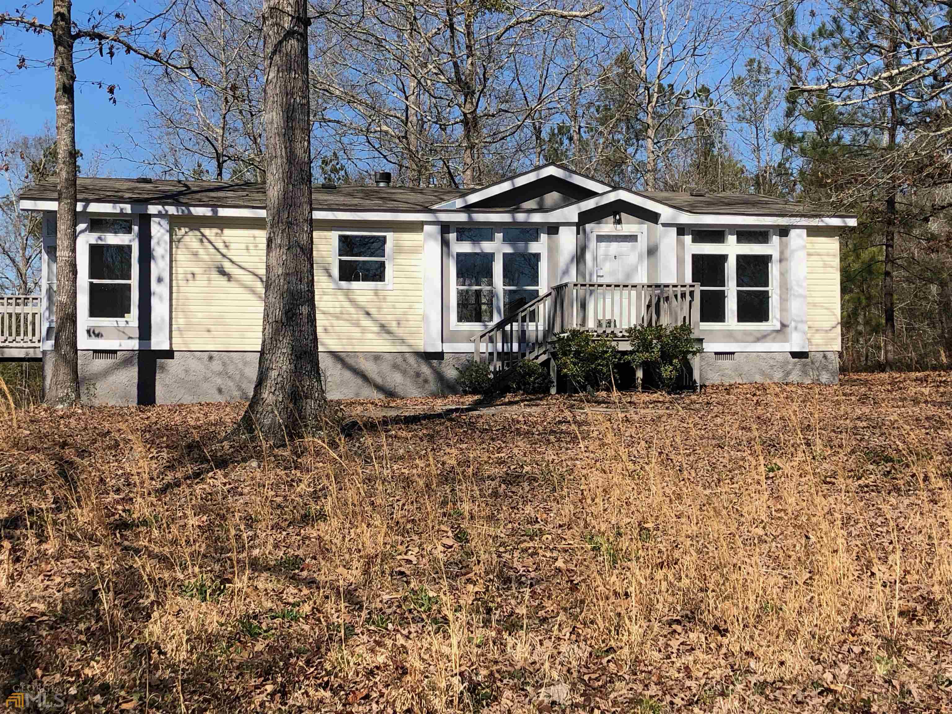 154 Wildwood Road Fort Valley, GA 31030 - Photo 1 of 1 a front view of a house with garden