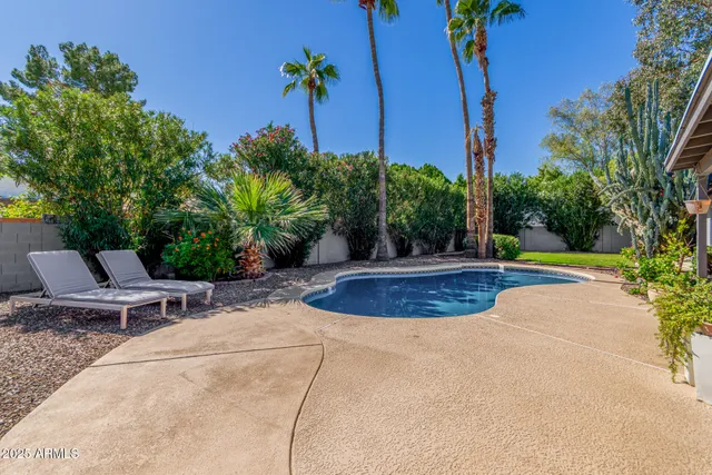 a view of a swimming pool with a patio