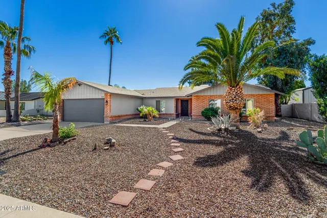 a house view with a backyard space