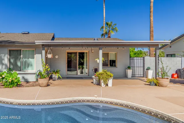 a front view of a house with a sitting space
