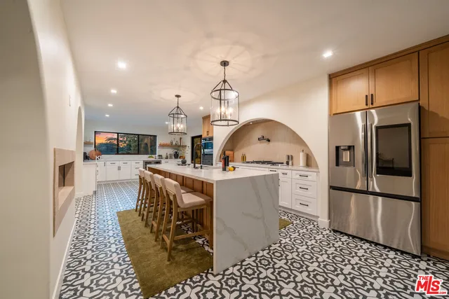 a kitchen with a sink cabinets and window