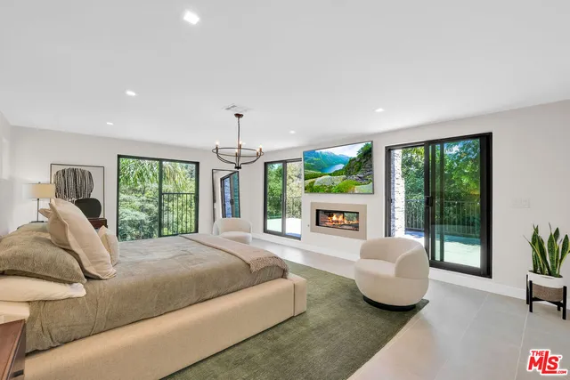 a bathroom with a double vanity sink mirror and shower