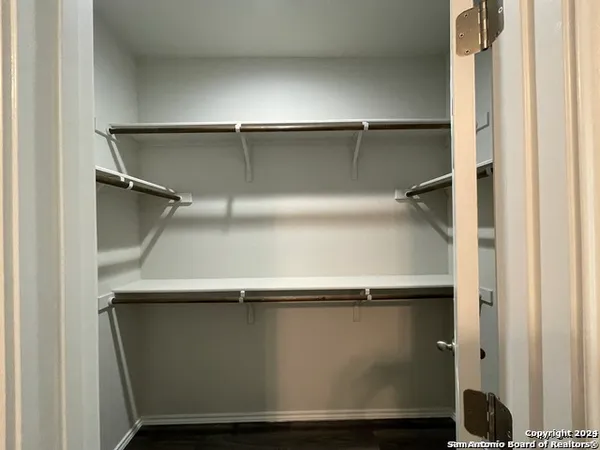 an empty room with wooden floor