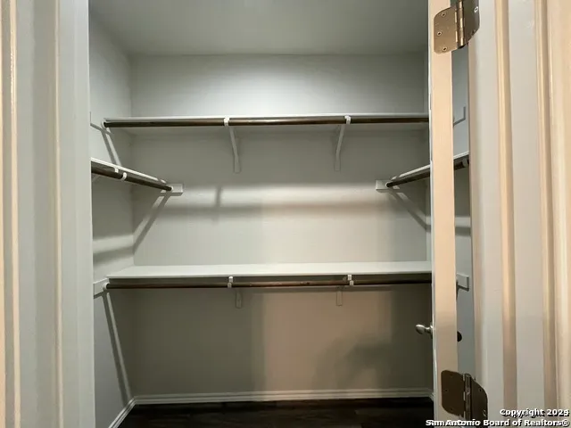 an empty room with wooden floor