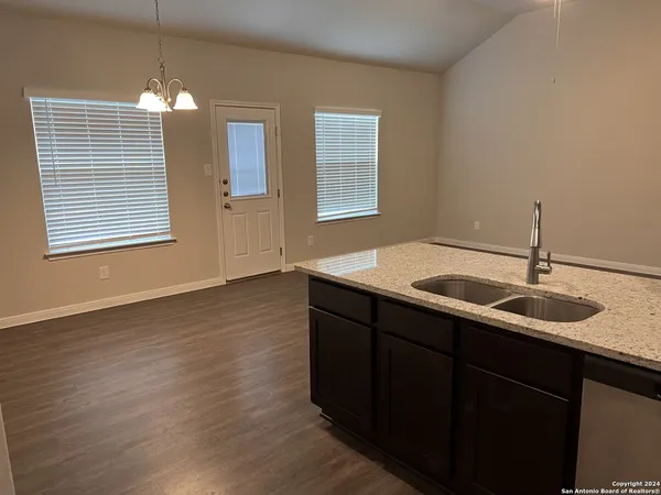 a kitchen with sink and window