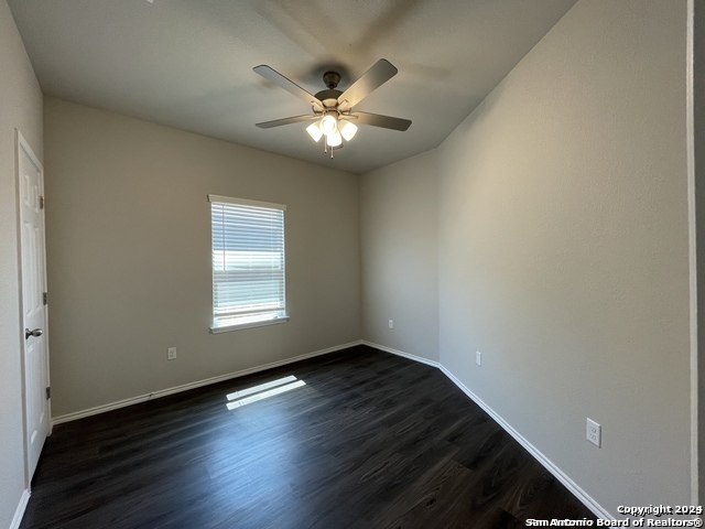 616 Grayson Lane Seguin, TX 78155 - Photo 8 of 17 a view of an empty room with wooden floor and a window