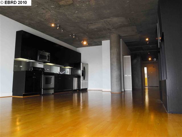 a kitchen with stainless steel appliances a refrigerator and a stove