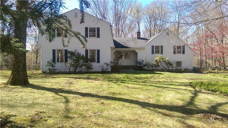 155 Old West Mountain Road Ridgefield, CT 06877 - Photo 1 of 1 a front view of house with yard and trees in the background