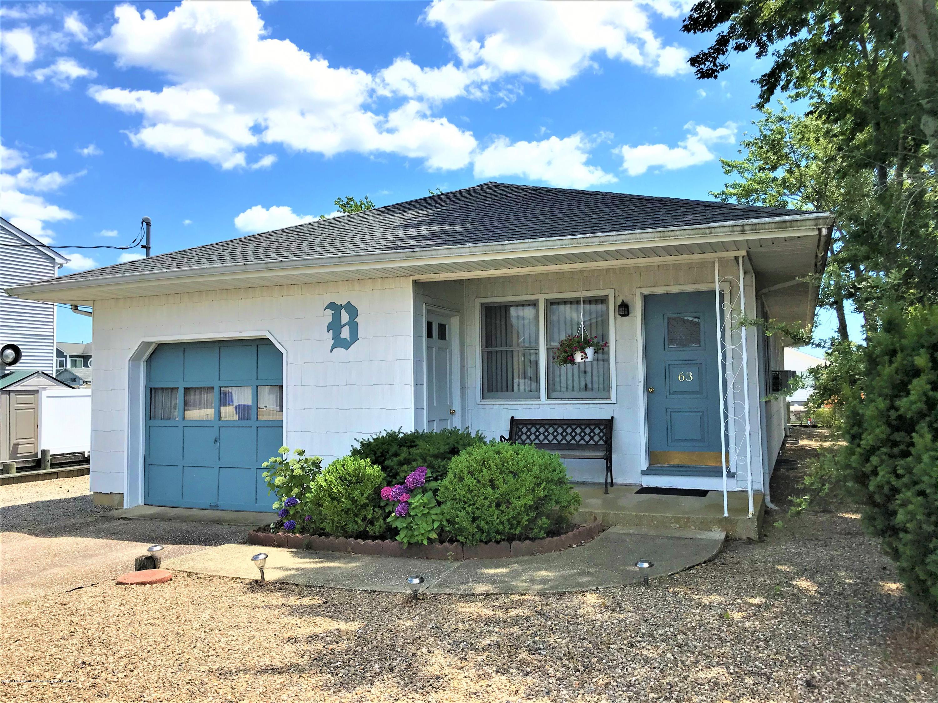 63 Mizzen Road Brick, NJ 08723 - Photo 1 of 37 a front view of a house with a yard