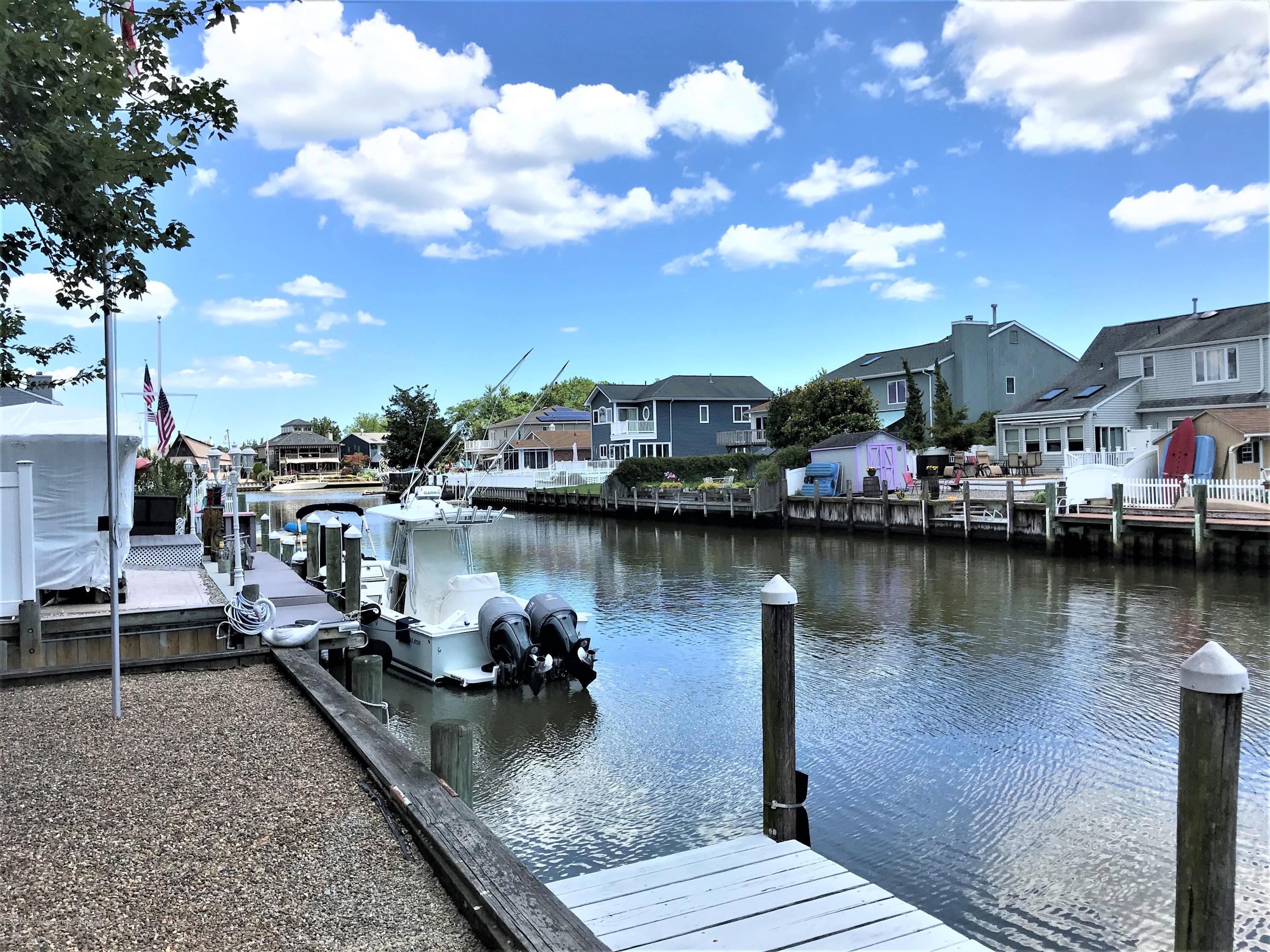 63 Mizzen Road Brick, NJ 08723 - Photo 2 of 37 a view of a lake with houses