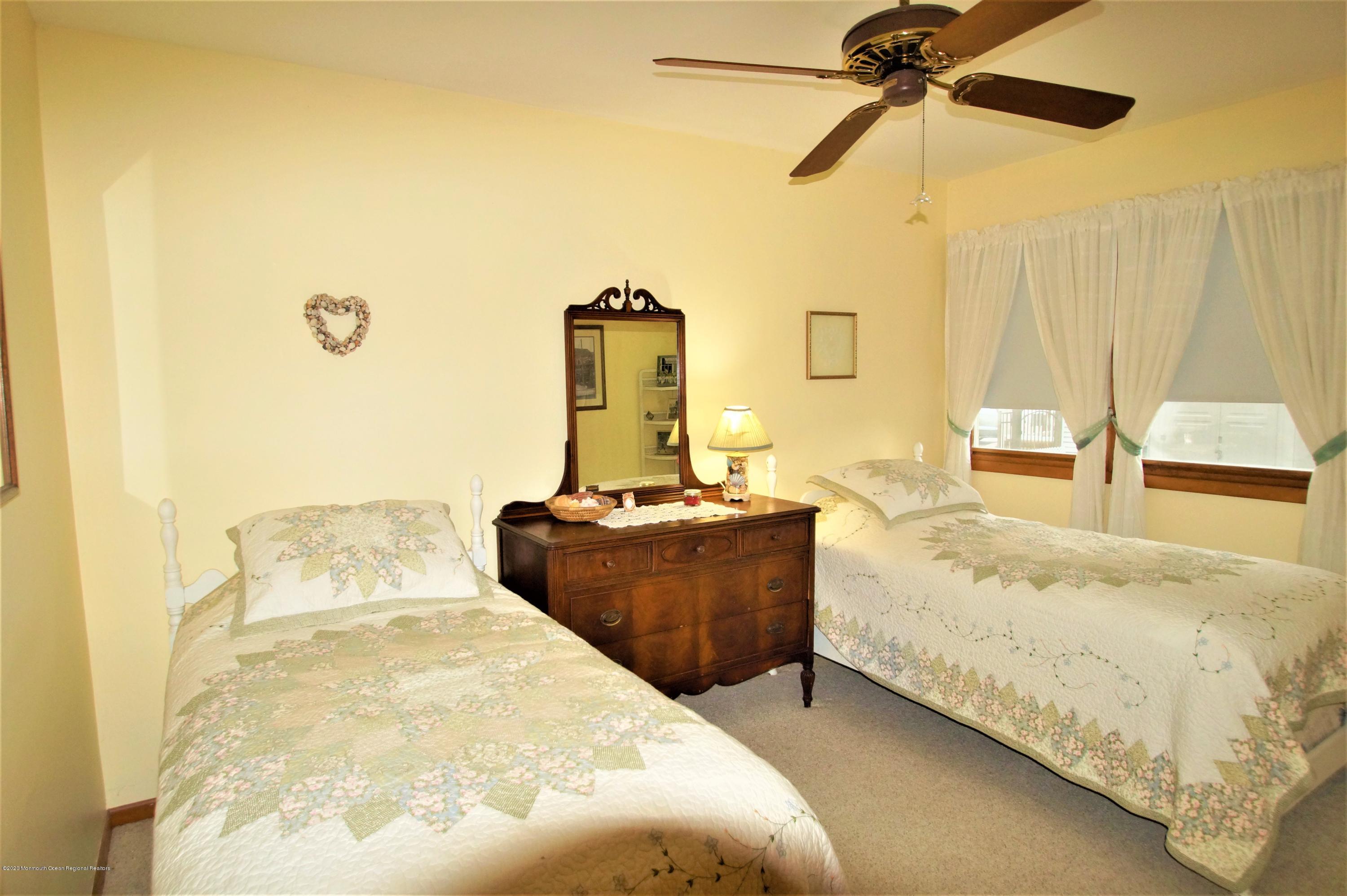 63 Mizzen Road Brick, NJ 08723 - Photo 28 of 37 a bedroom with a bed and wooden floor