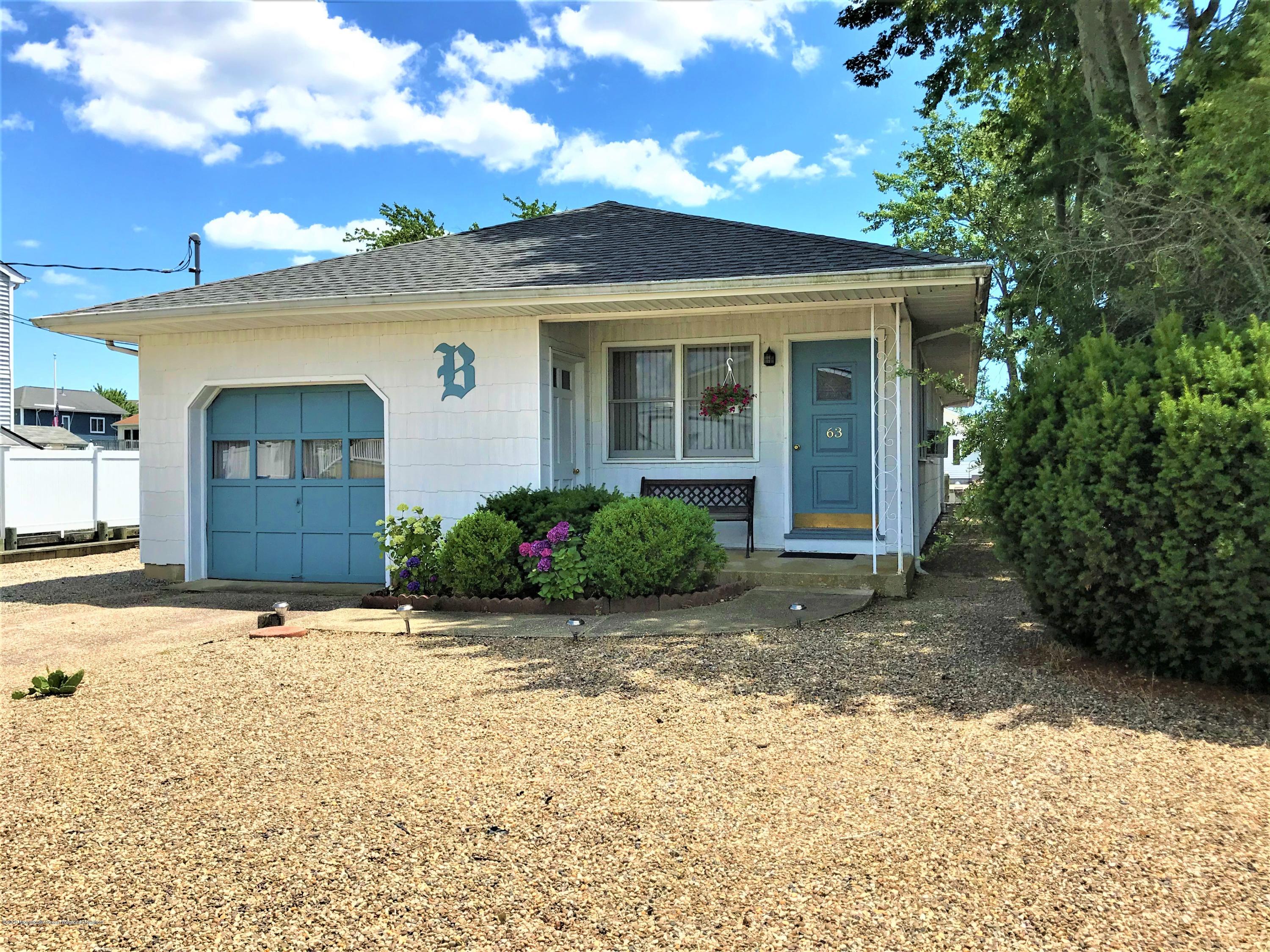 63 Mizzen Road Brick, NJ 08723 - Photo 3 of 37 a front view of a house with a yard
