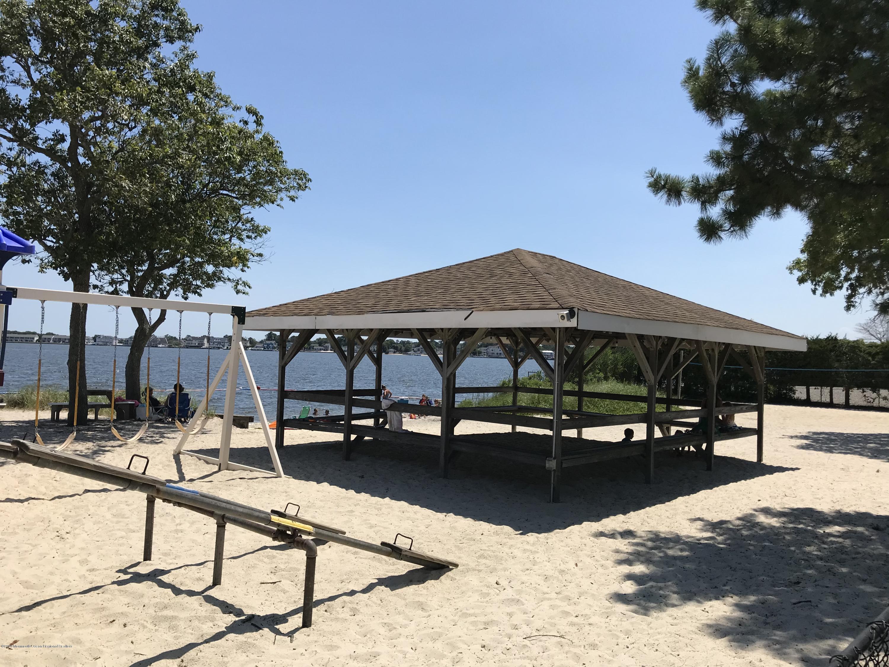 63 Mizzen Road Brick, NJ 08723 - Photo 33 of 37 a view of patio with chairs and tables