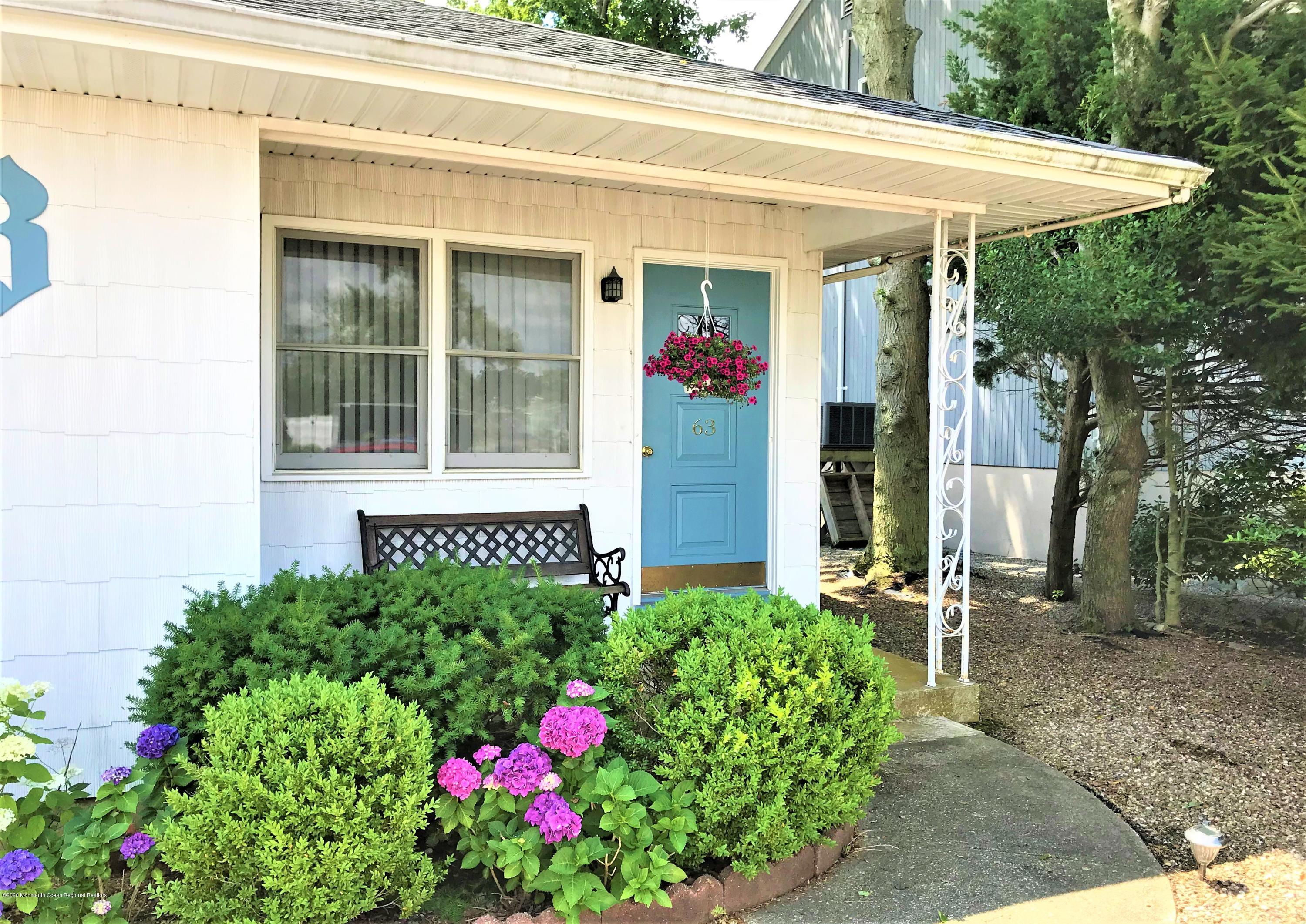 63 Mizzen Road Brick, NJ 08723 - Photo 35 of 37 a front view of a house with plants